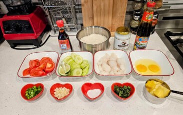 a table with bowls of food and ingredients