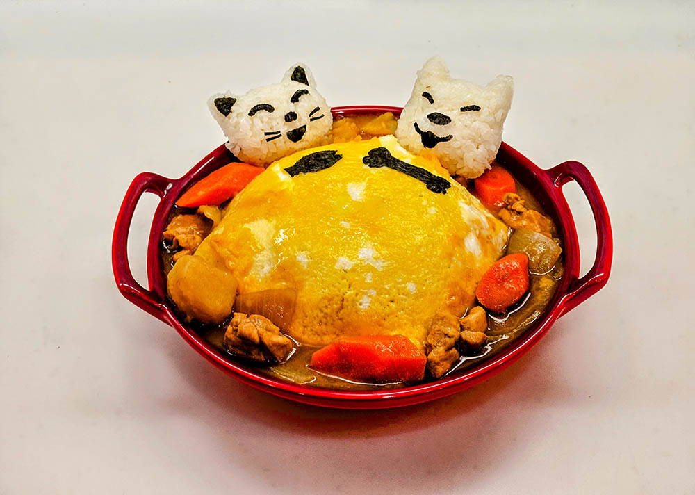 a bowl of food with cats faces