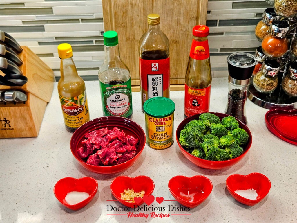 Ingredients for Chinese Beef and Broccoli Recipe, including soy sauce, sesame oil, cornstarch, broccoli, and beef slices.