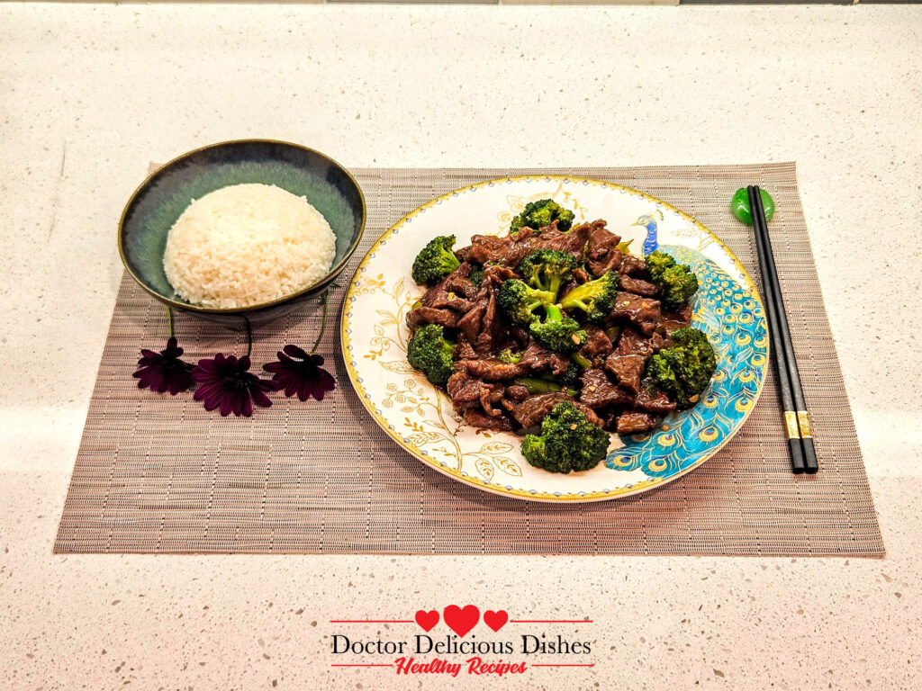 Plated Chinese Beef and Broccoli Recipe with rice, served on a decorative plate.