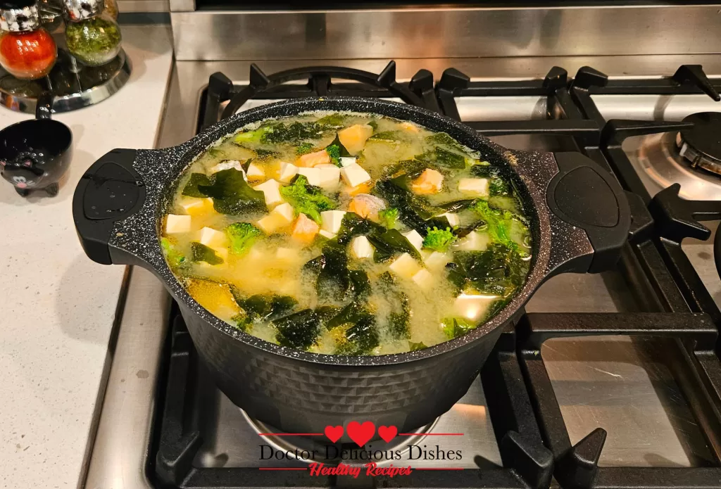 The sixth image presents a pot filled with the completed Savory Salmon Tofu Miso Soup with Broccoli, ready to serve.