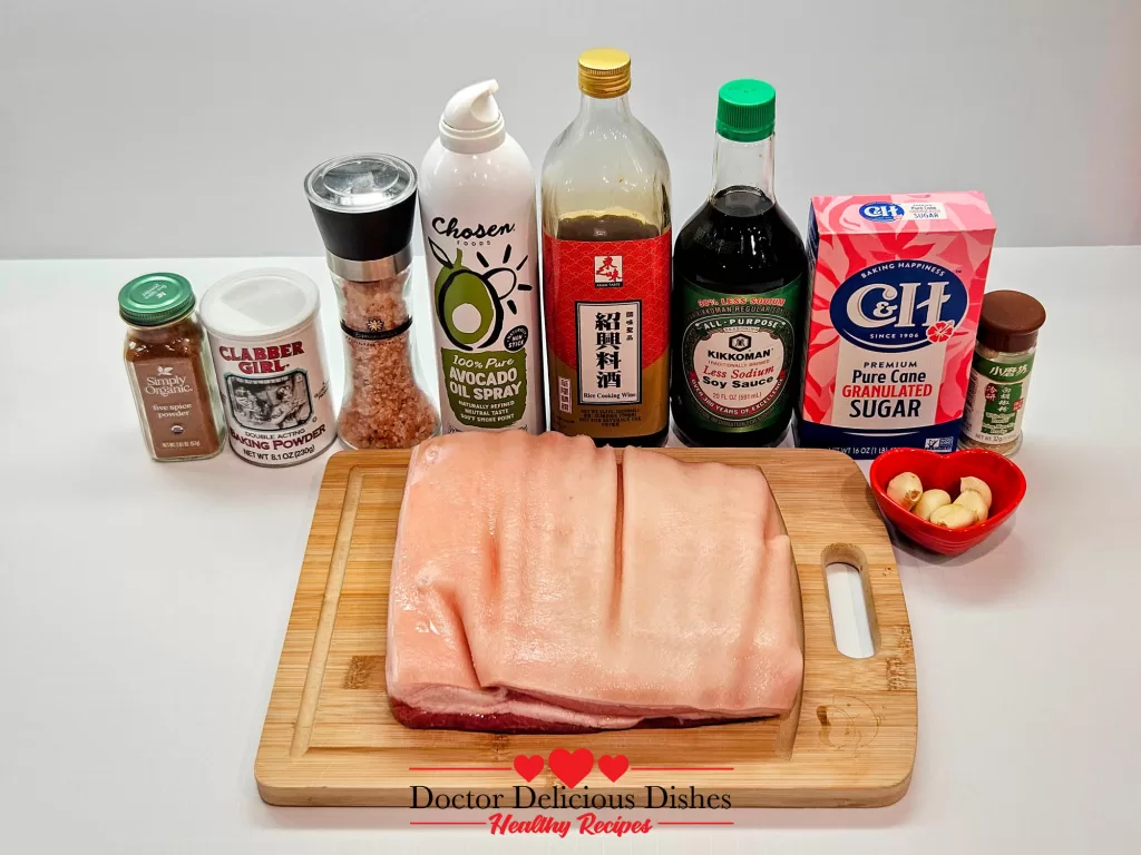 Ingredients for Instant Pot Crispy Pork Belly Recipe, including pork belly, soy sauce, rice cooking wine, sugar, garlic, and seasonings.