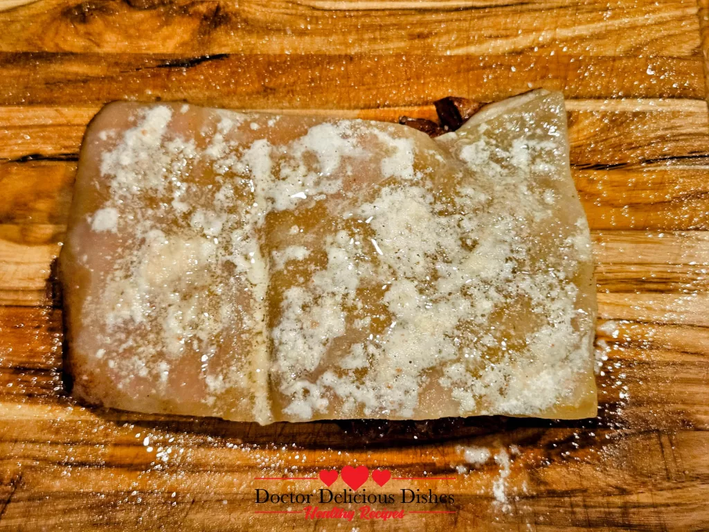 Seasoned pork belly with baking powder and salt mix, generously sprayed with avocado oil, prepped and ready for the air fryer.