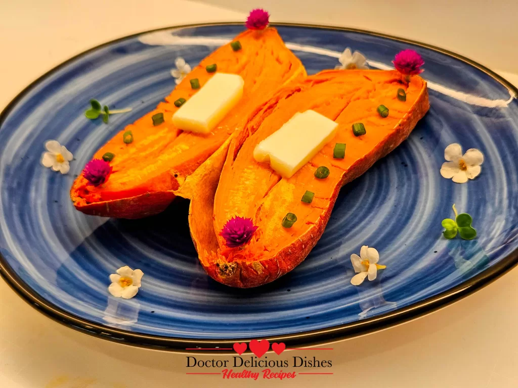 Close-up of sweet potato with melted butter and edible flowers