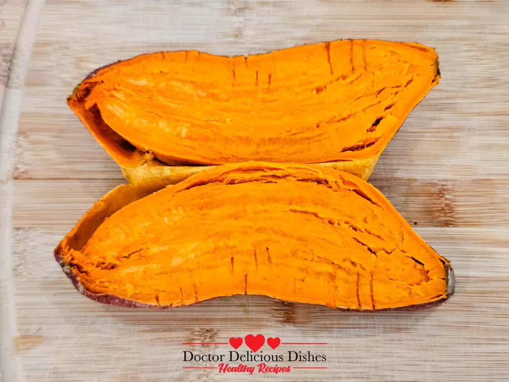 Microwave sweet potato cut in half to reveal soft, vibrant orange interior
