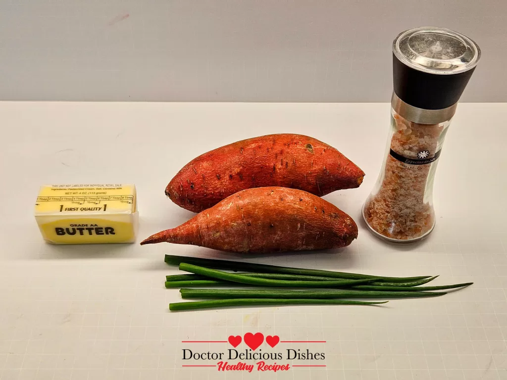 Ingredients for microwave sweet potato including butter, sweet potato, green onion, and pink Himalayan salt