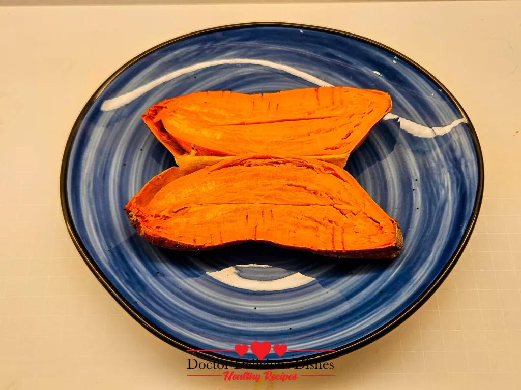 Microwaved sweet potato halves arranged on a blue plate for serving