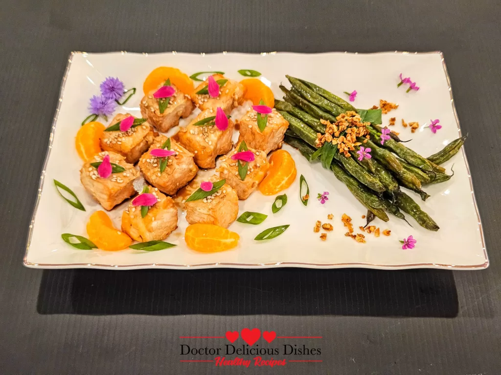 Air Fryer Green Beans paired with air fryer salmon bites on a platter for a healthy, beautiful meal