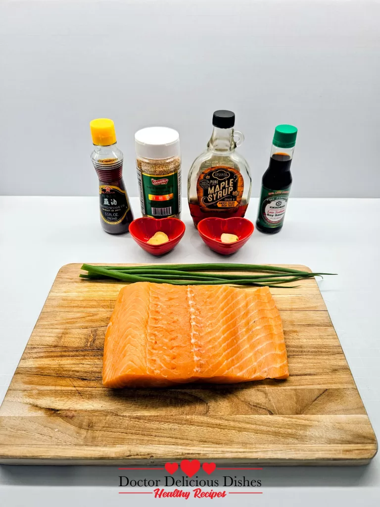 Ingredients for Air Fryer Salmon Bites with maple syrup, soy sauce, garlic, ginger, sesame oil, and salmon
