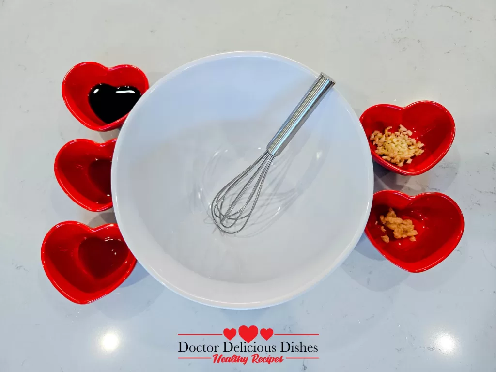 Heart-shaped bowls with marinade ingredients for Air Fryer Salmon Bites