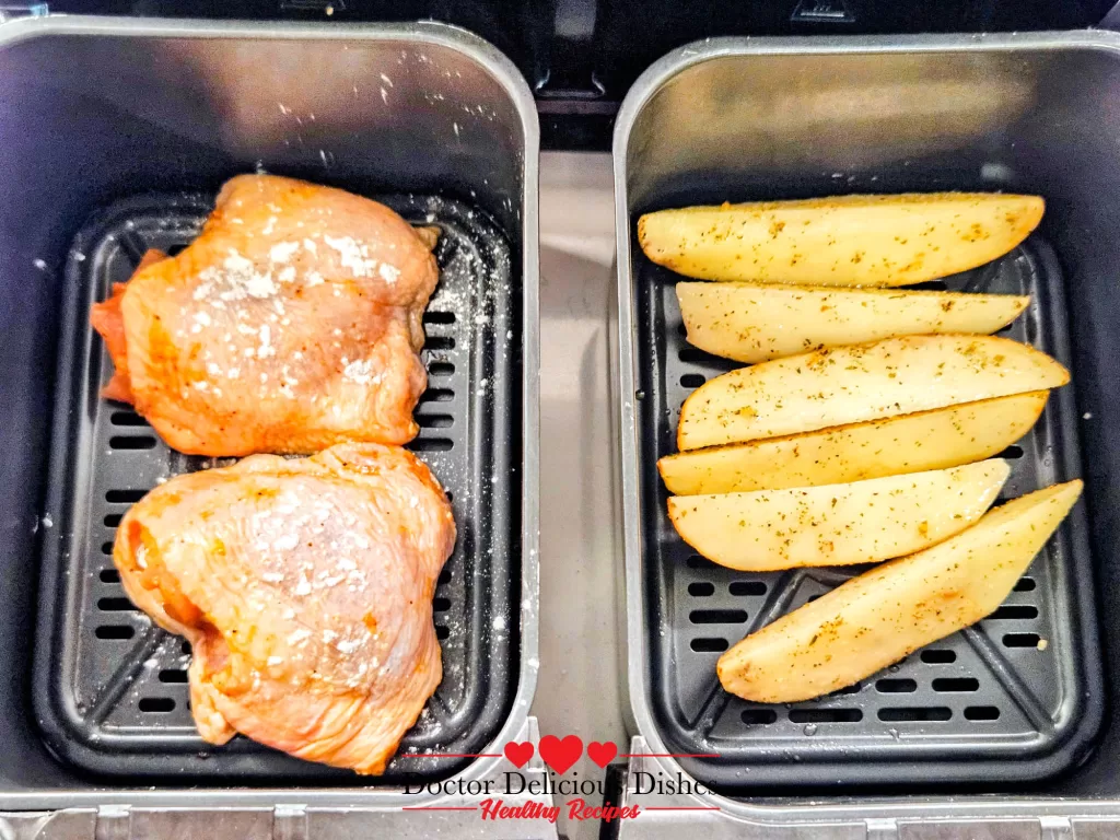 Air Fryer Chicken Thighs sprinkled with baking powder on top for extra crispy skin.