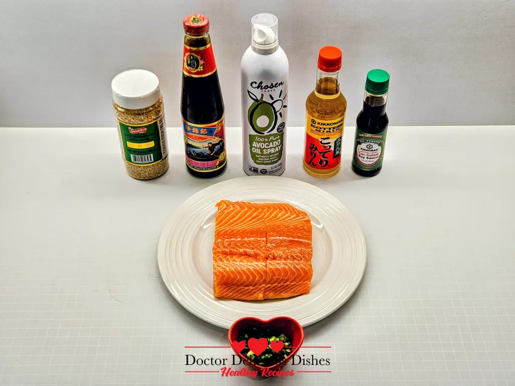 Ingredients for homemade Teriyaki Salmon: soy sauces, mirin, sesame seeds, scallions, and salmon for Air Fryer Salmon
