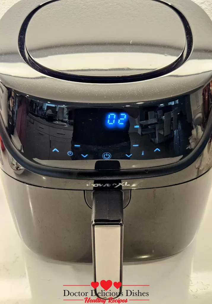 Air fryer showing 2 minutes left to finish Air Fryer Salmon.