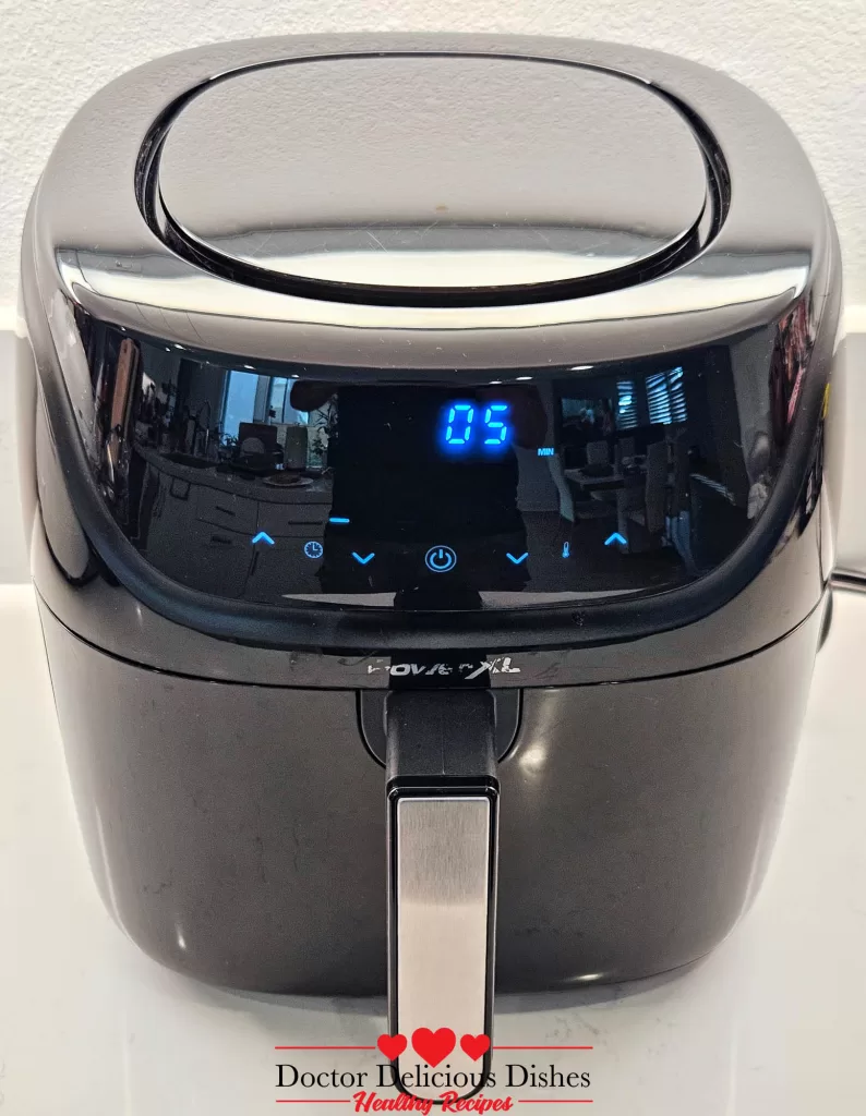 Air fryer timer set to 5 minutes for preheating.