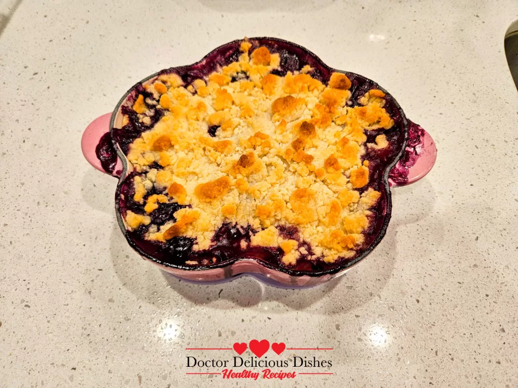 Golden baked apple blueberry crumble recipe fresh from oven.