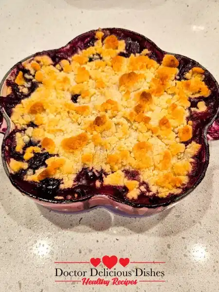 Golden baked apple blueberry crumble recipe fresh from oven.