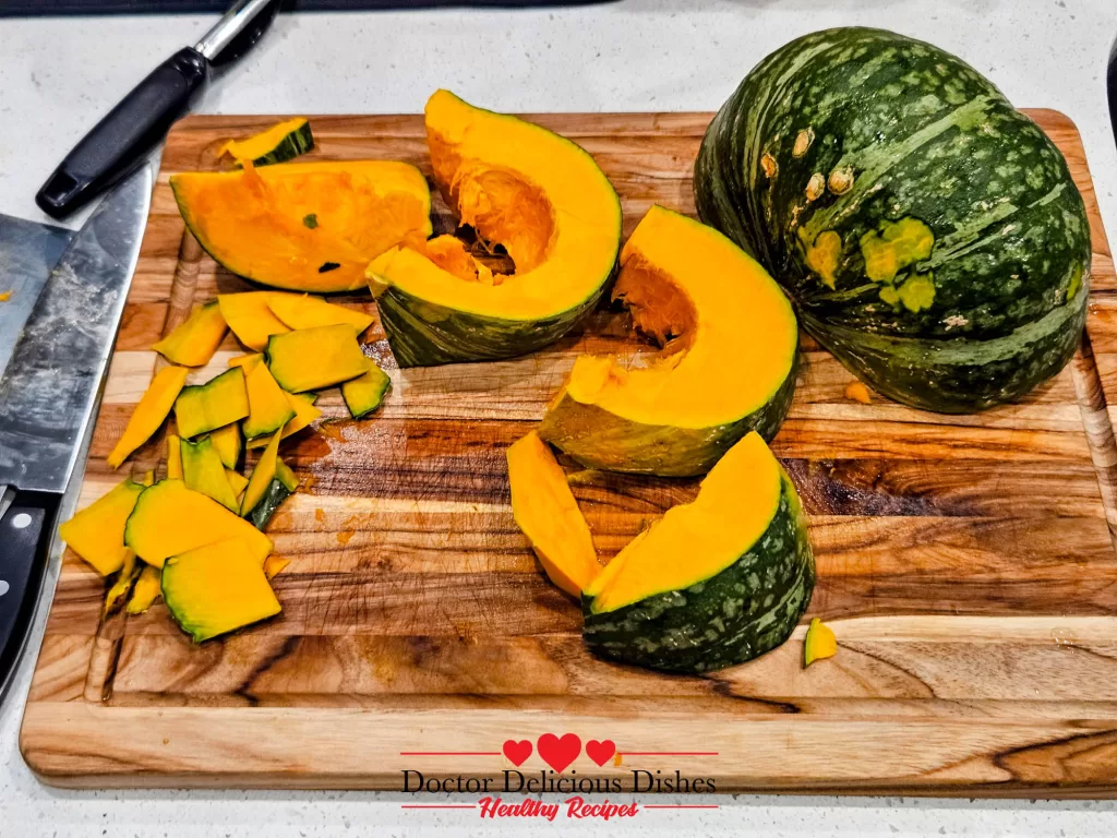 Fresh kabocha squash being cut and peeled for Easy Halloween Kabocha Pumpkin Cake.