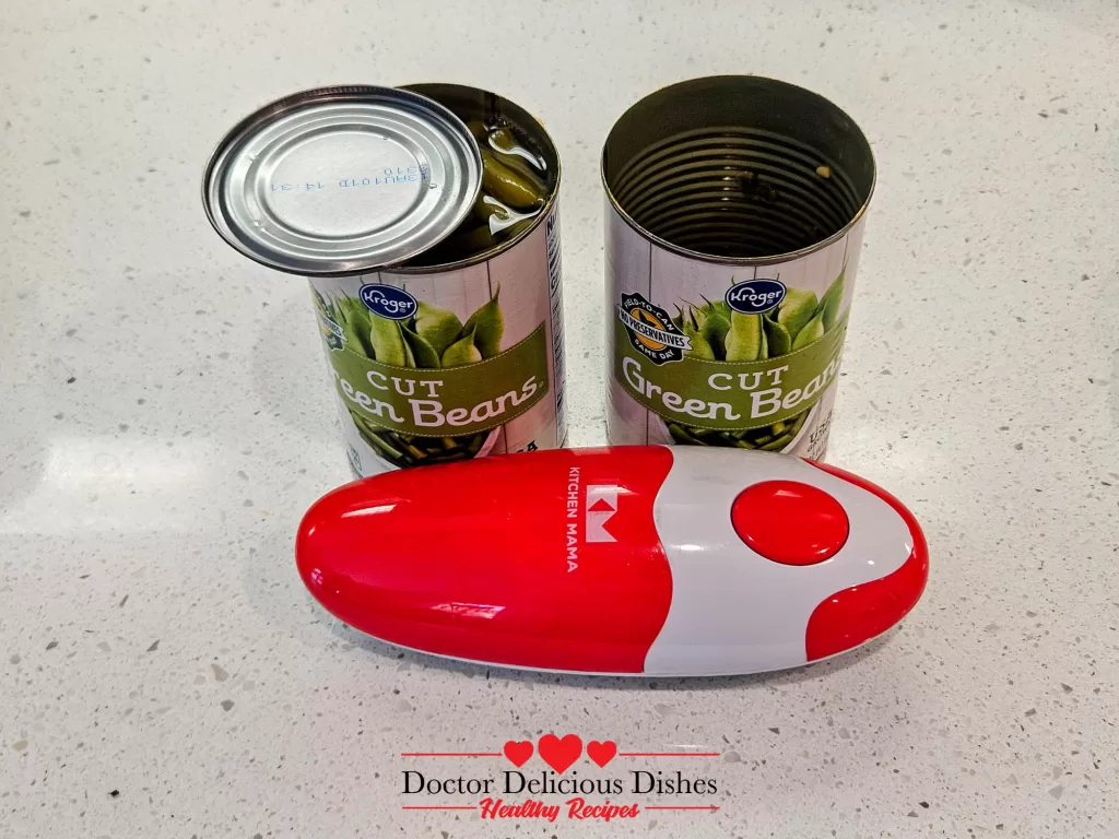 Open canned green beans with Kitchen Mama can opener for an easy green bean casserole recipe.