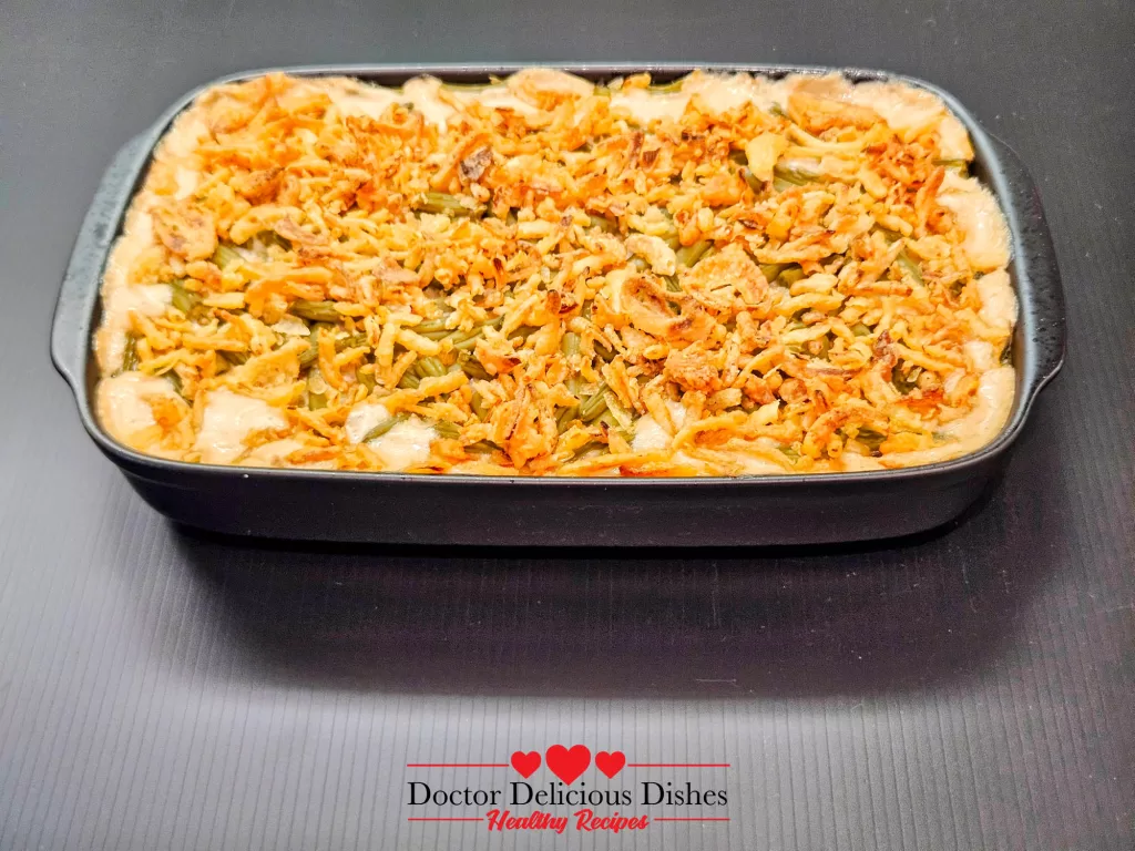 Freshly baked green bean casserole recipe topped with golden crispy onions
