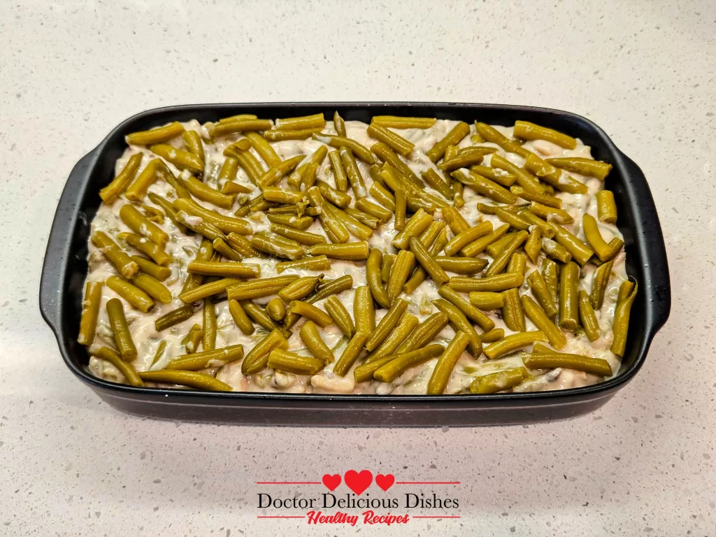 Green bean casserole recipe mixture in a baking dish before topping and baking.