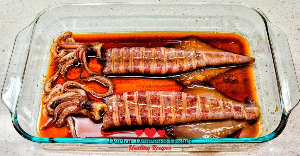 Squid fully marinated in soy sauce, mirin, sake, and ginger mixture for Japanese grilled squid (Ikayaki).