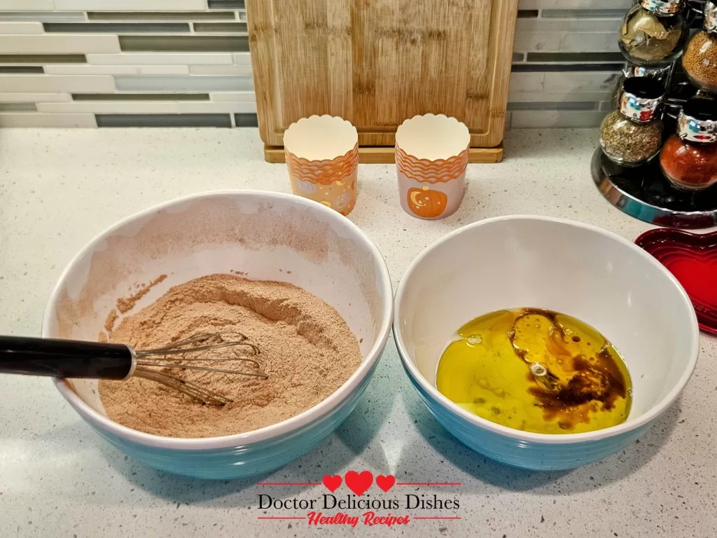 Chocolate protein batter mixed in a bowl for Halloween cupcakes.