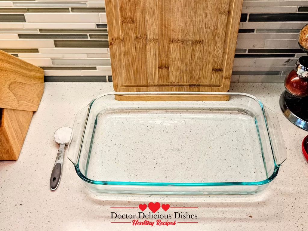 Glass dish prepared with measuring spoon ready for soaking tofu skin recipe.