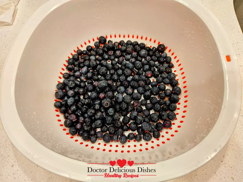 Fresh blueberries washed and drained for apple blueberry crumble recipe.