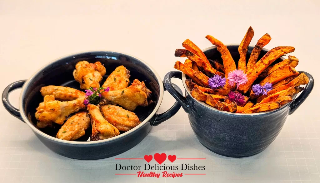 Crispy air fryer sweet potato fries and juicy air fryer chicken wings paired together in styled bowls – Doctor Delicious Dishes
