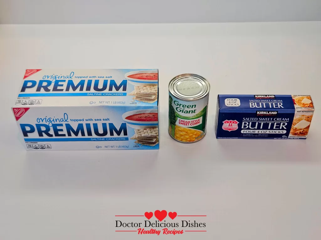 Ingredients for Easy Corn Casserole Recipe including butter, saltine crackers, and cream-style corn.