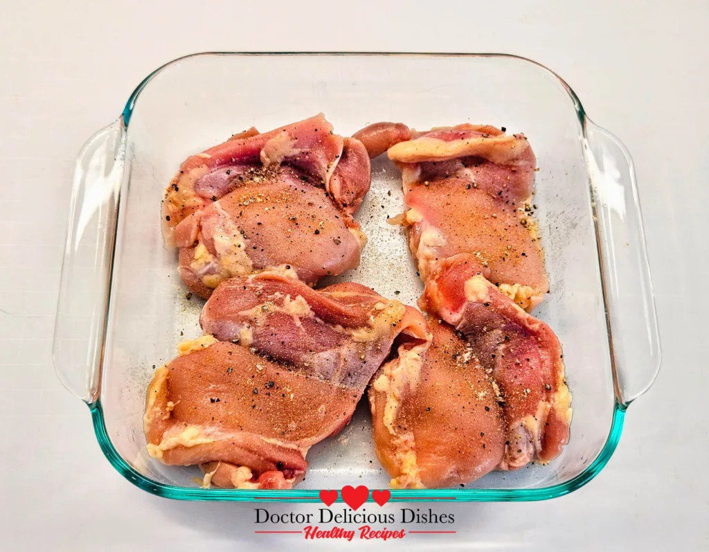 Chicken thighs seasoned with spices and pink Himalayan salt for air fryer chicken katsu.
