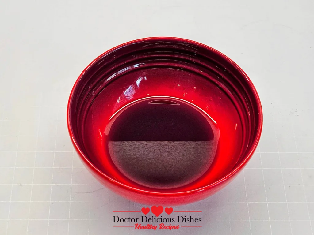 Air fryer corn on the cob glaze mixture in a small bowl