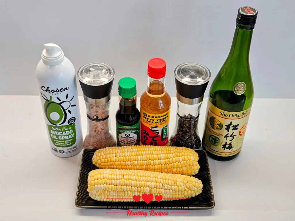 Ingredients for air fryer corn on the cob, including soy sauce, sake, and seasonings, arranged neatly before cooking. Japanese style Yaki‑tōmorokoshi.
