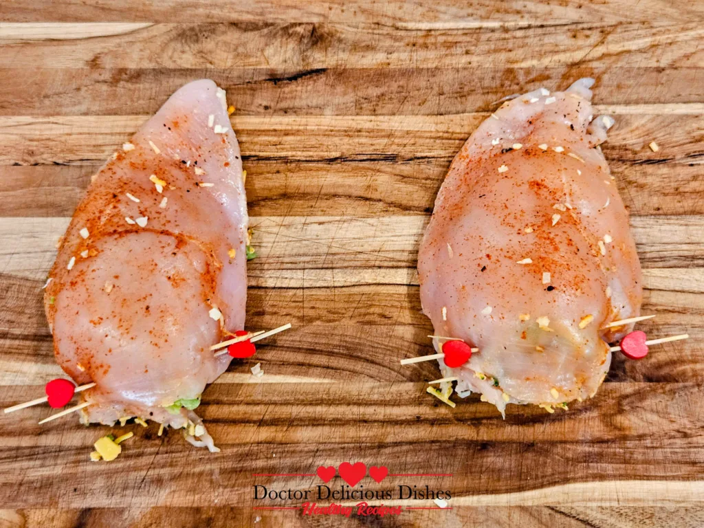 stuffed chicken breasts secured with toothpicks before placing in air fryer