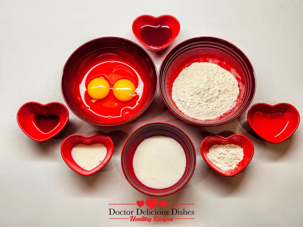 Ingredients for Honey Castella Cake arranged in heart bowls for air fryer baking.