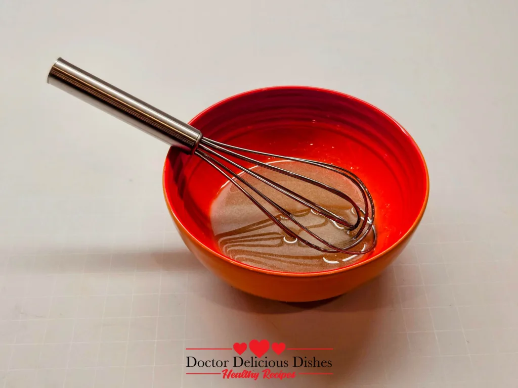 Whisking warm honey and milk mixture for air fryer Honey Castella Cake batter