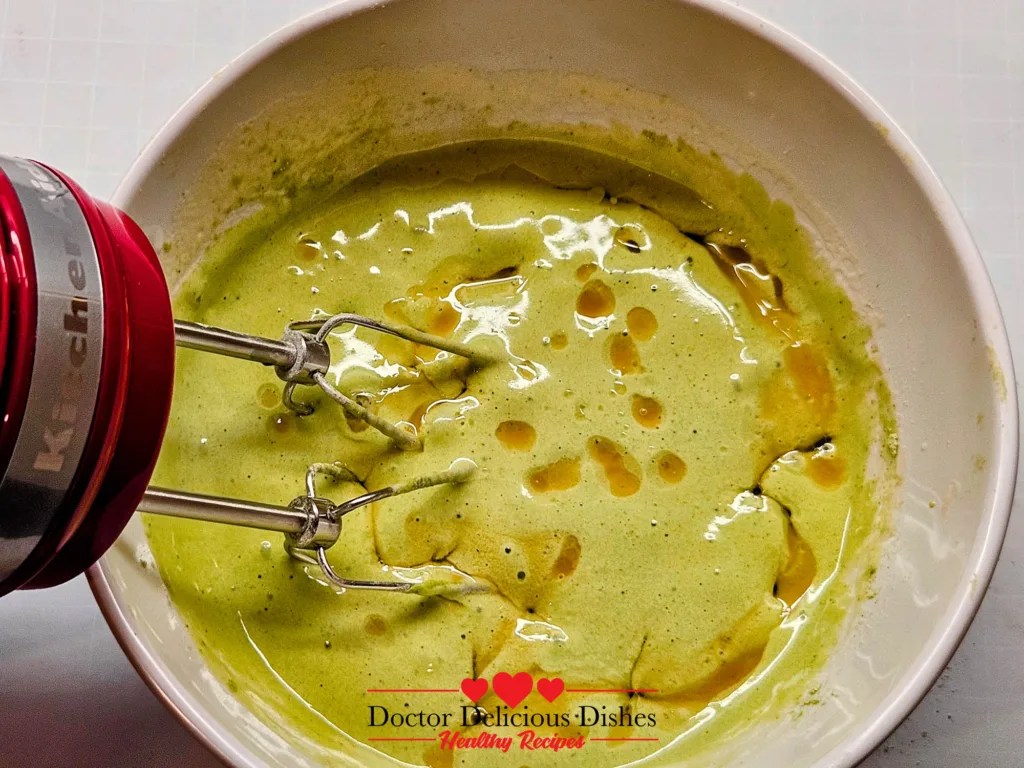 Matcha Castella Cake batter with honey drizzled in before final mixing